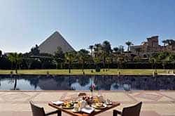 Le Meridien Pyramids luxury hotel is beautifully set in its own landscaped gardens southwest of Cairo, Egypt and less than one mile from the Sphinx and the Giza Pyramids.