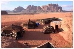 Wadi Rum also known as The Valley of the Moon is a valley cut into the sandstone and granite rock in southern Jordan 37 miles to the east of Aqaba; it is the largest wadi in Jordan.