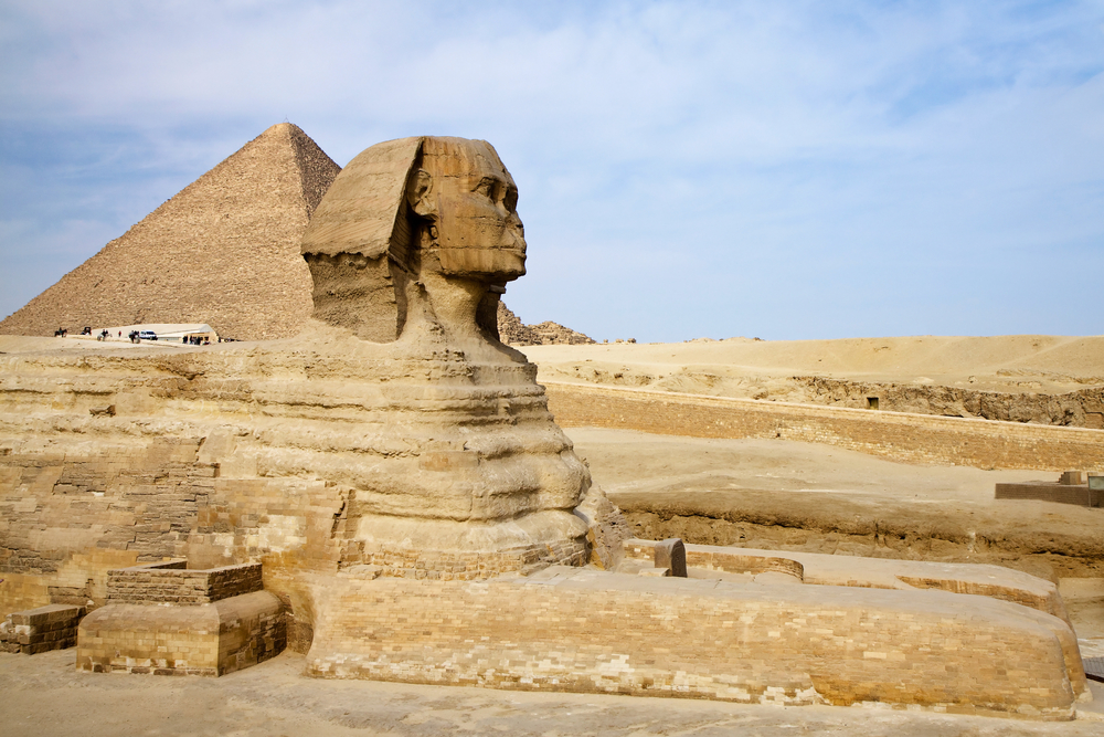 Ancient Egyptian Sphinx with the Great Pyramid in Giza