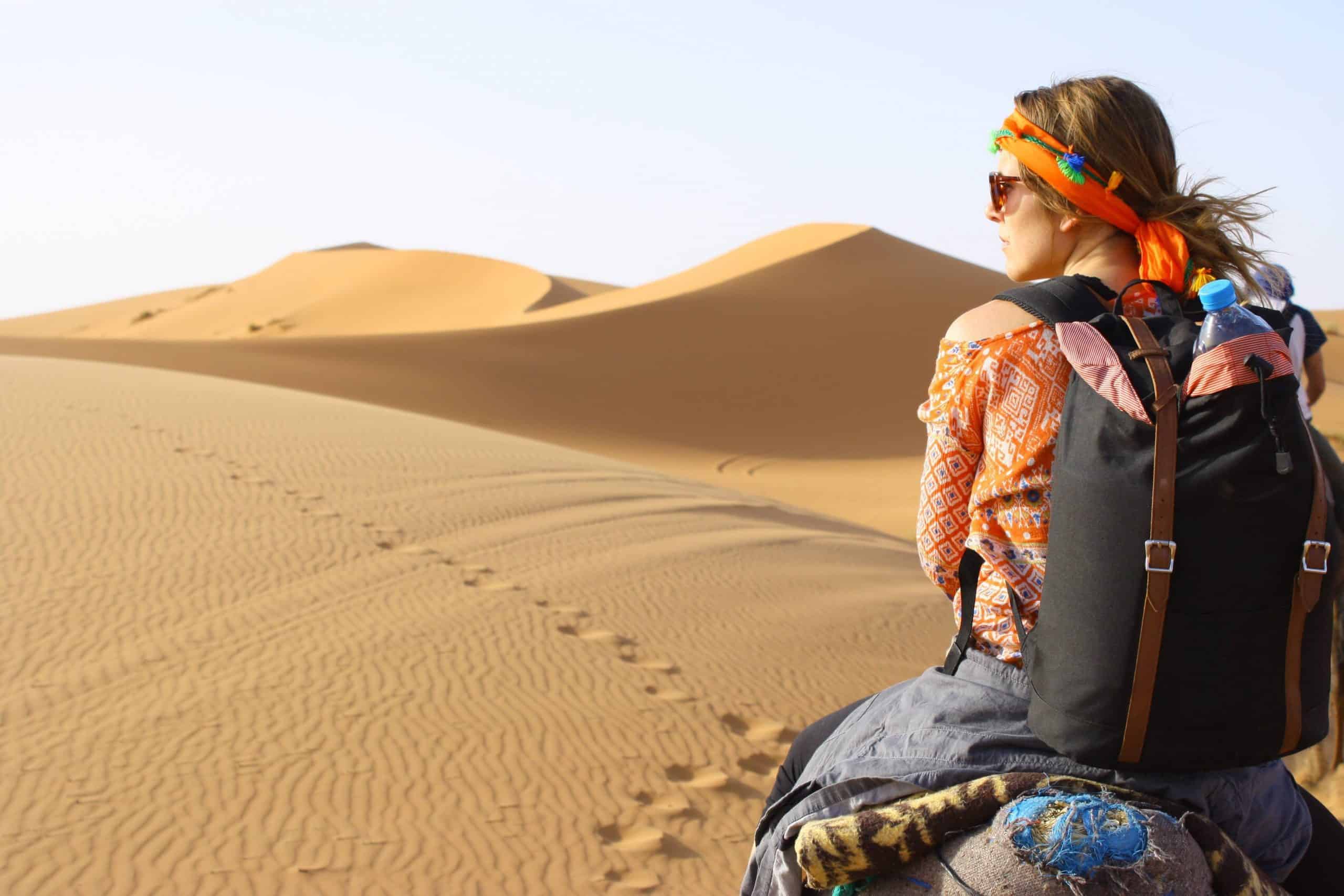 Woman riding in the Sahara Desert in Morocco