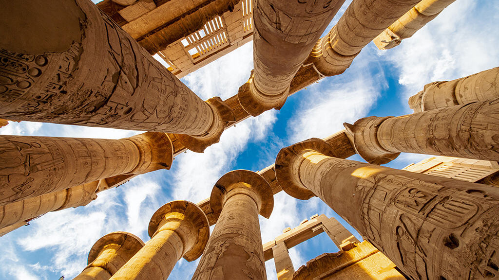 Karnak Hypostyle hall columns and clouds in the Temple at Luxor Thebes
